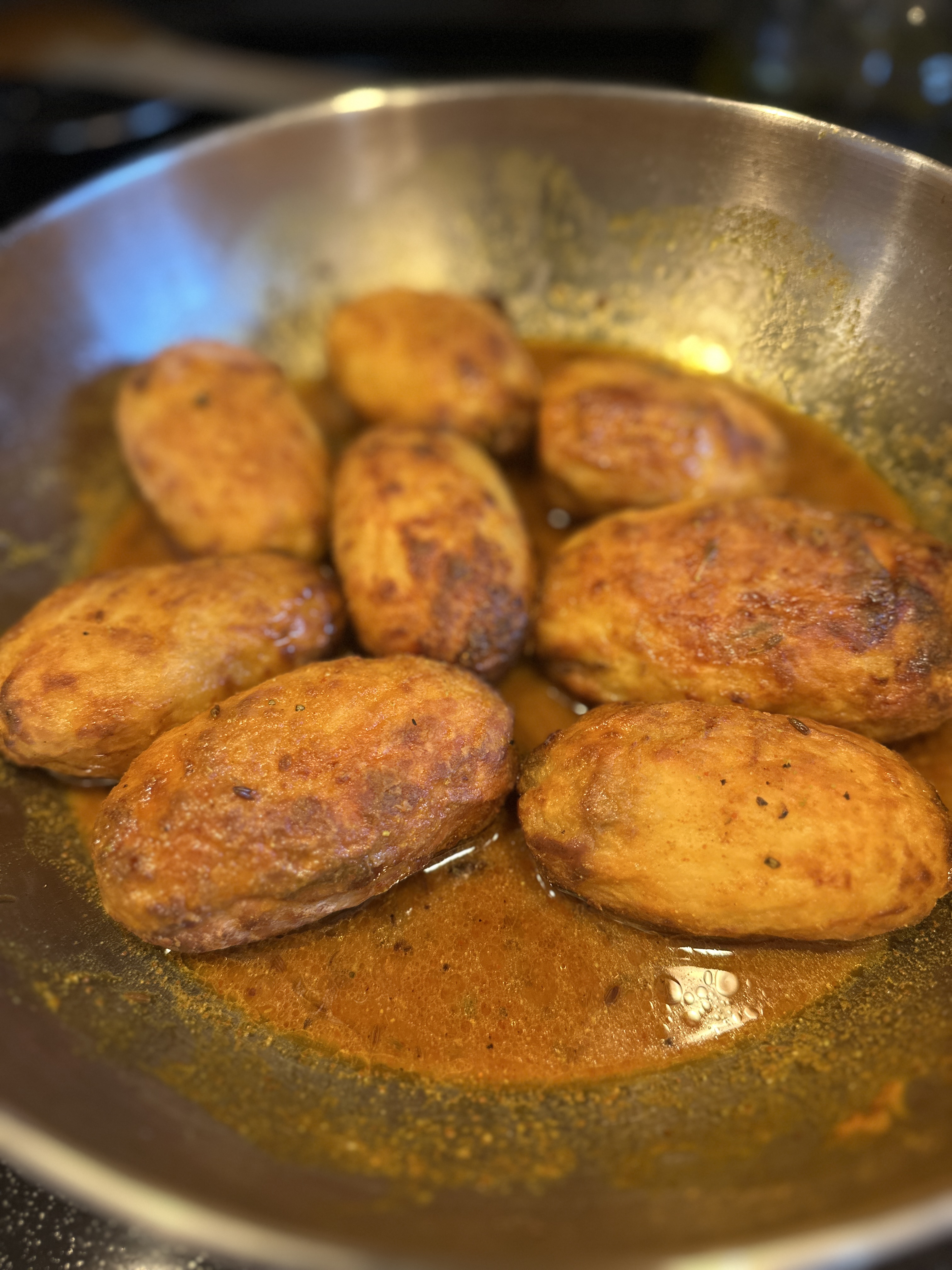 Sauce spooned over the potatoes